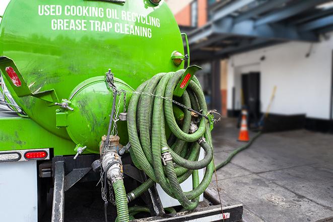 grease trap pumping truck in action in Carefree AZ