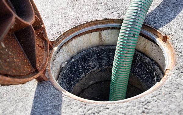 foul odors, slow draining sinks, and grease buildup in the trap are all signs that grease trap pumping services are needed